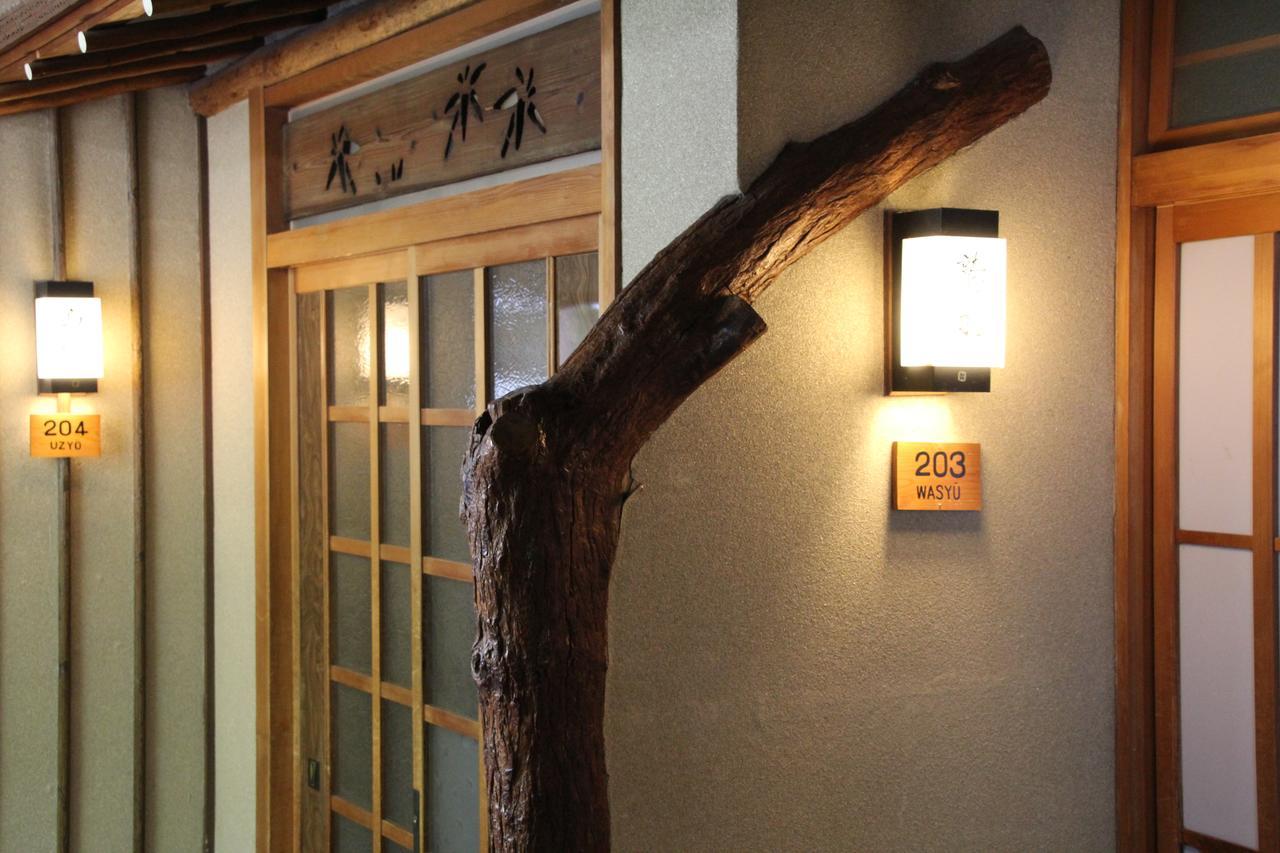 Hotel Tomada Onsen Iyashi No Yado Sensui Okayama Exterior foto